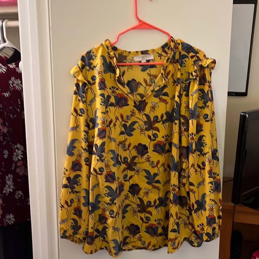 Yellow peasant type blouse with leaves on it.